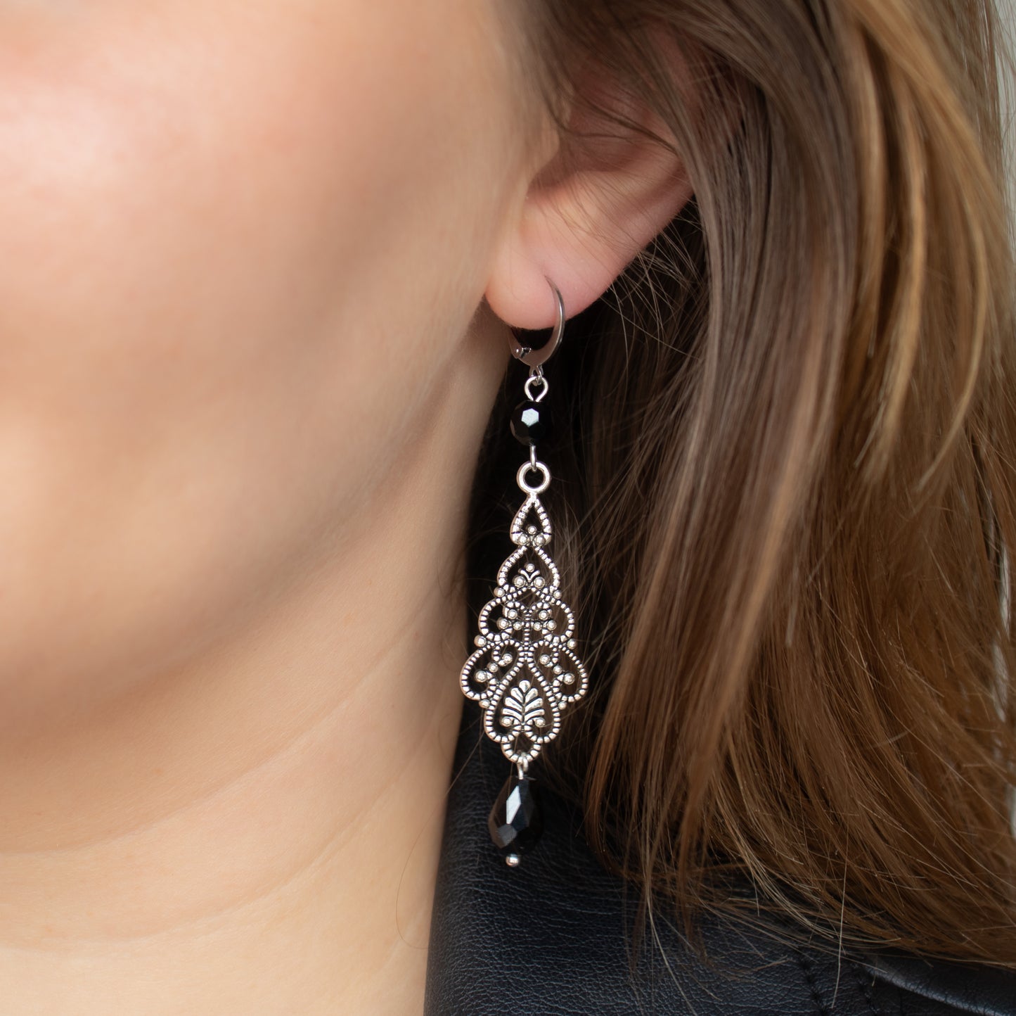Handmade Ornament Earrings with Black Beads and Silver Charms
