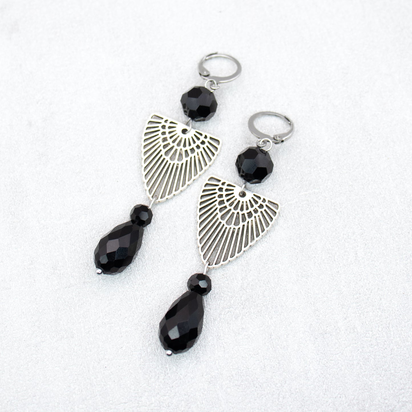 Black beads with silver charms. Handmade earrings.