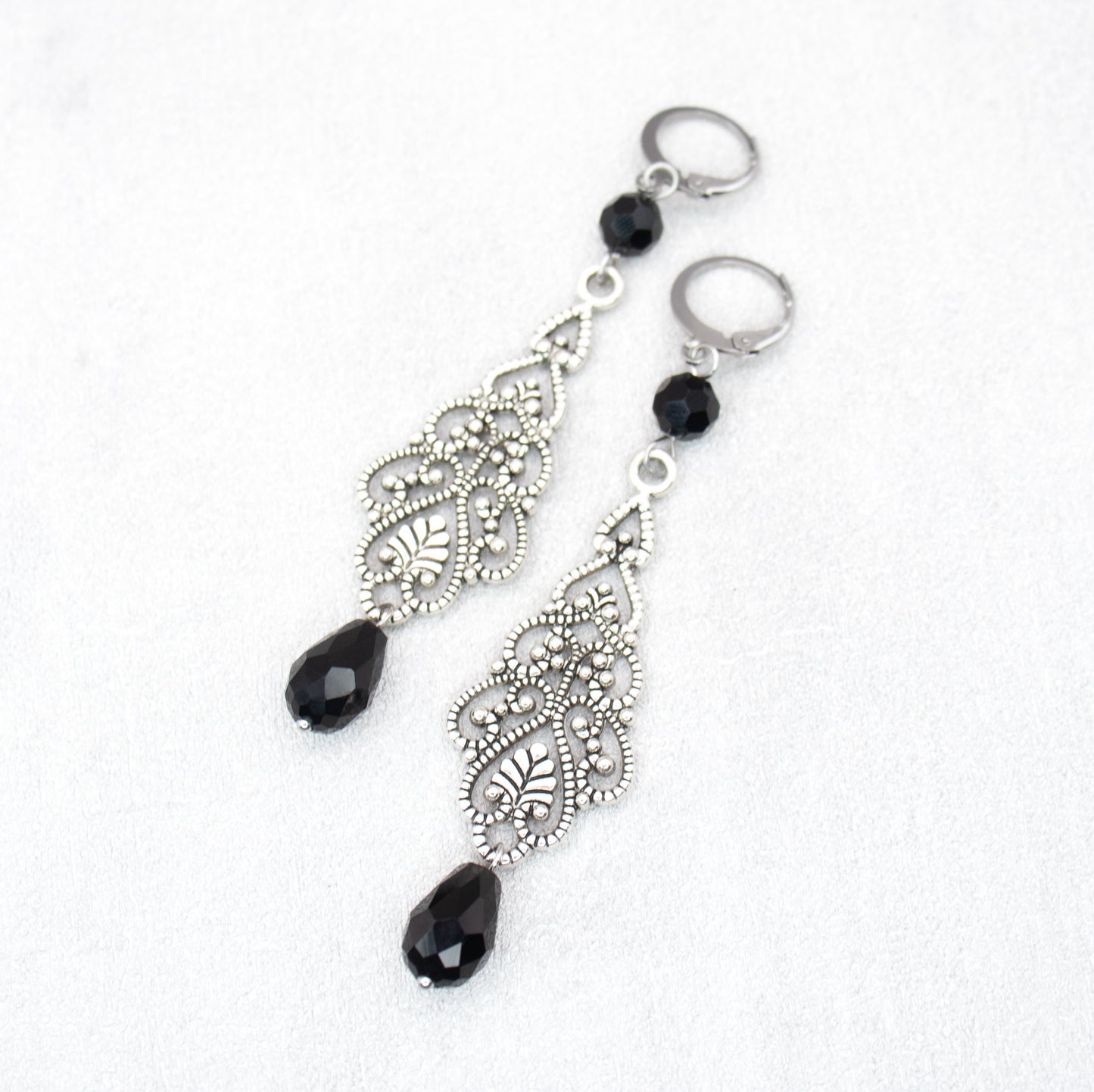 Handmade Ornament Earrings with Black Beads and Silver Charms